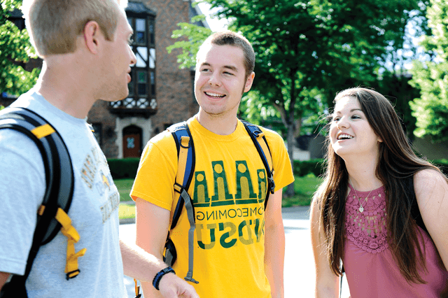 students talking outside